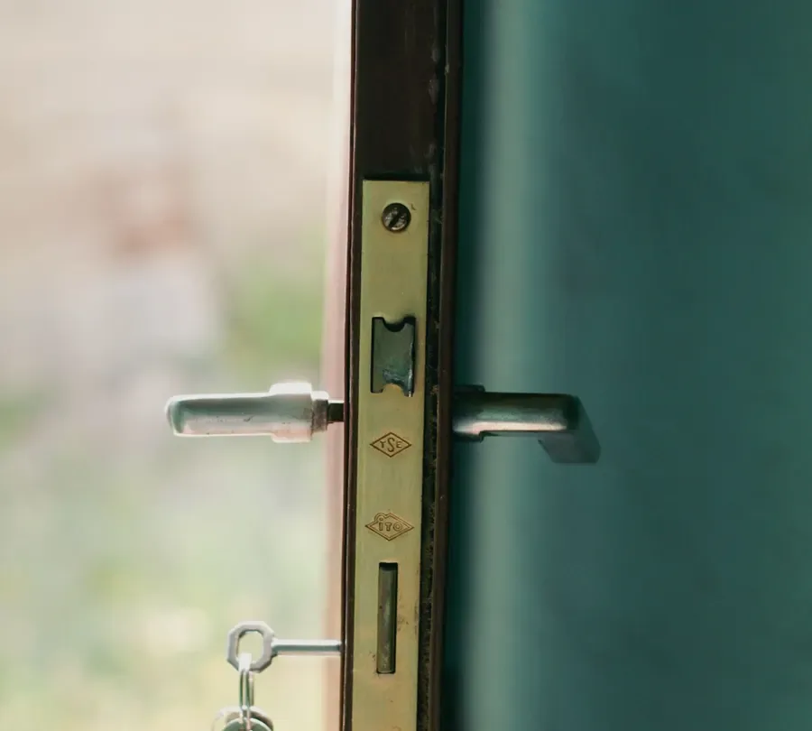 Open door showing the locking edge and handle – checking for lock repair or replacement in Boston with the door open, Locksmith Boston