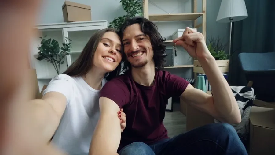Couple holding up keys in their new home – residential locksmith Boston help for homeowners from Locksmith Boston