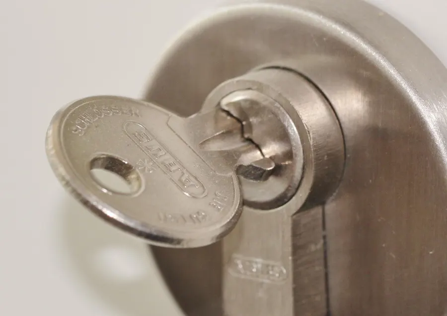 Key inserted in a door lock cylinder